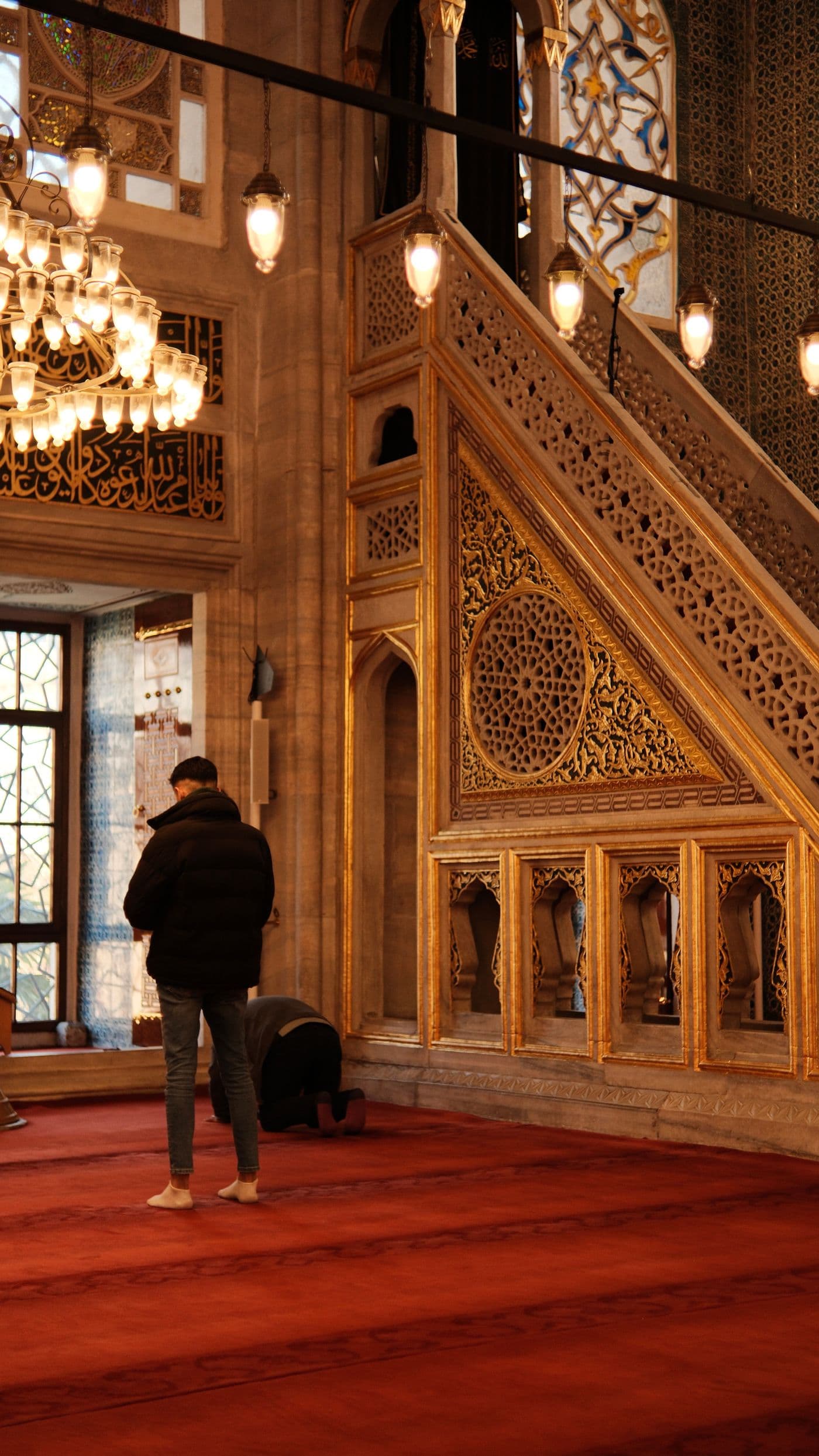 A young man praying in a mosque